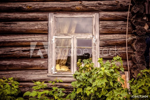 Picture of Glazed window of an old abandoned wooden house
